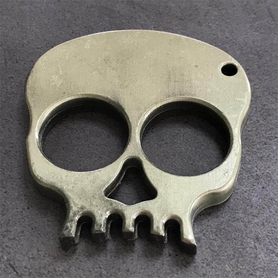 Herramienta de decoración portátil EDC para exteriores con calavera de dos dedos