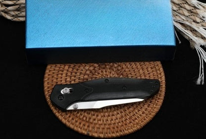 Utensile pieghevole da esterno BM940 con manico in G10 e superficie stonewashed