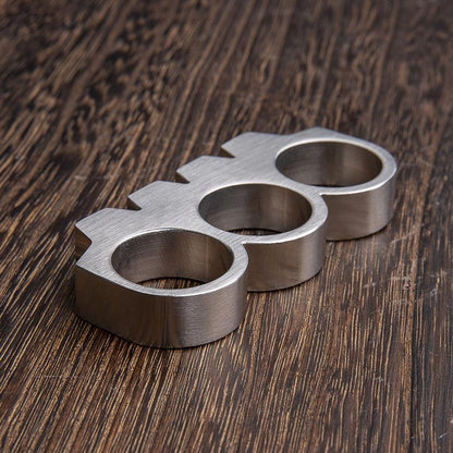 Schlagring-Briefbeschwerer