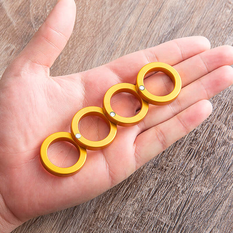 Light aluminium folding brass knuckles in hand for self defense brass knuckles. Compact and stylish everyday carry weapon.