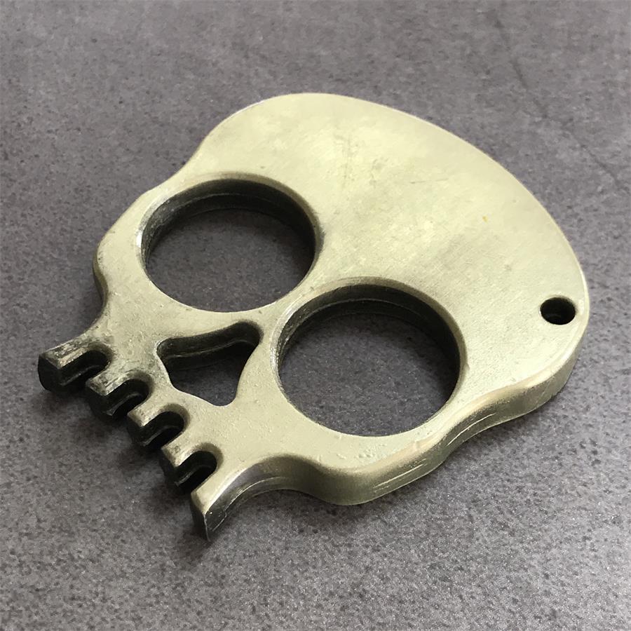 Herramienta de decoración portátil EDC para exteriores con calavera de dos dedos
