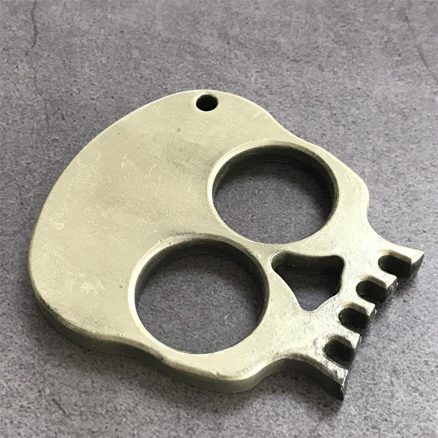 Herramienta de decoración portátil EDC para exteriores con calavera de dos dedos